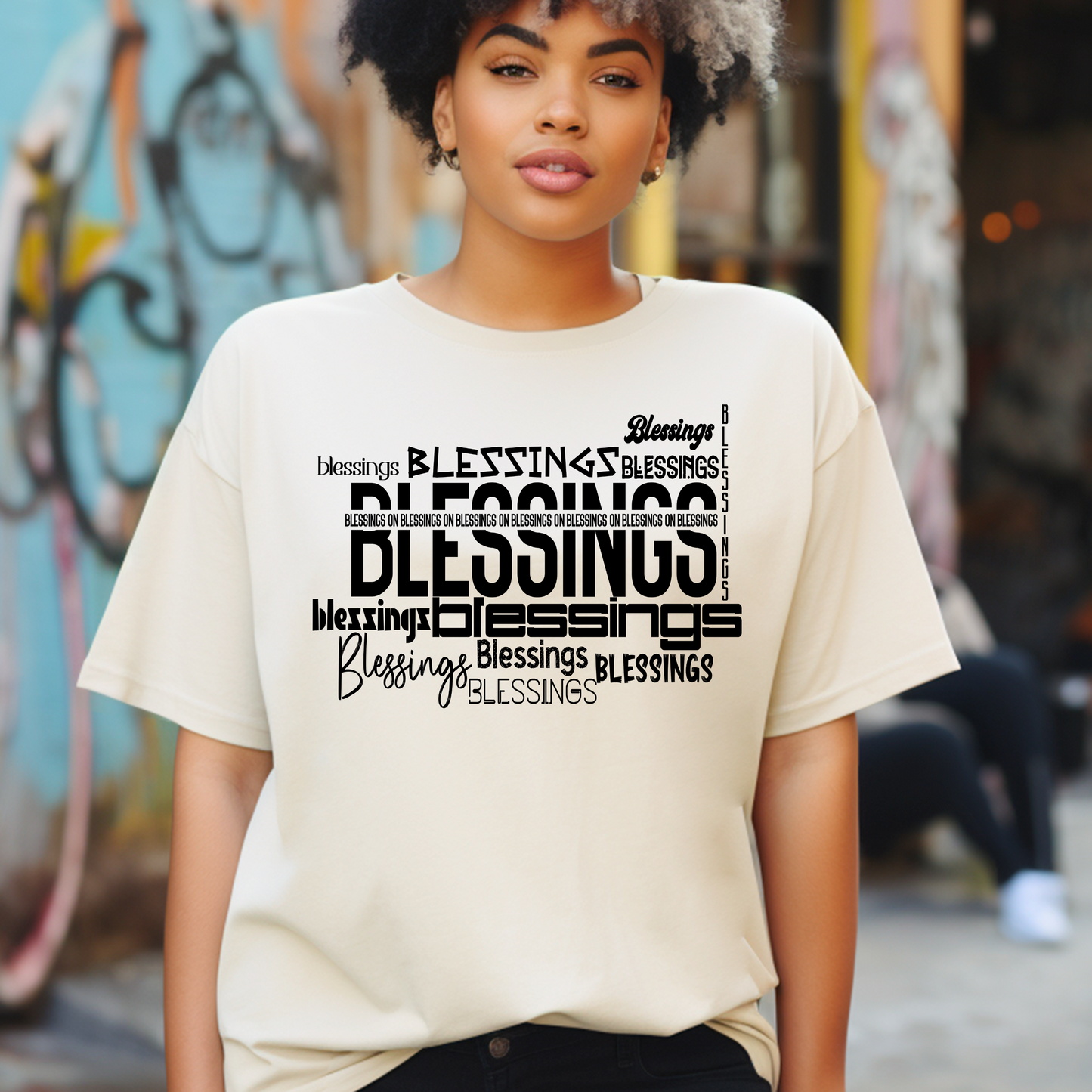 Elegant tan 'Blessings on Blessings' T-shirt from Triumph Tees. This faith-inspired apparel features a striking design, perfect for those who want to express their beliefs stylishly