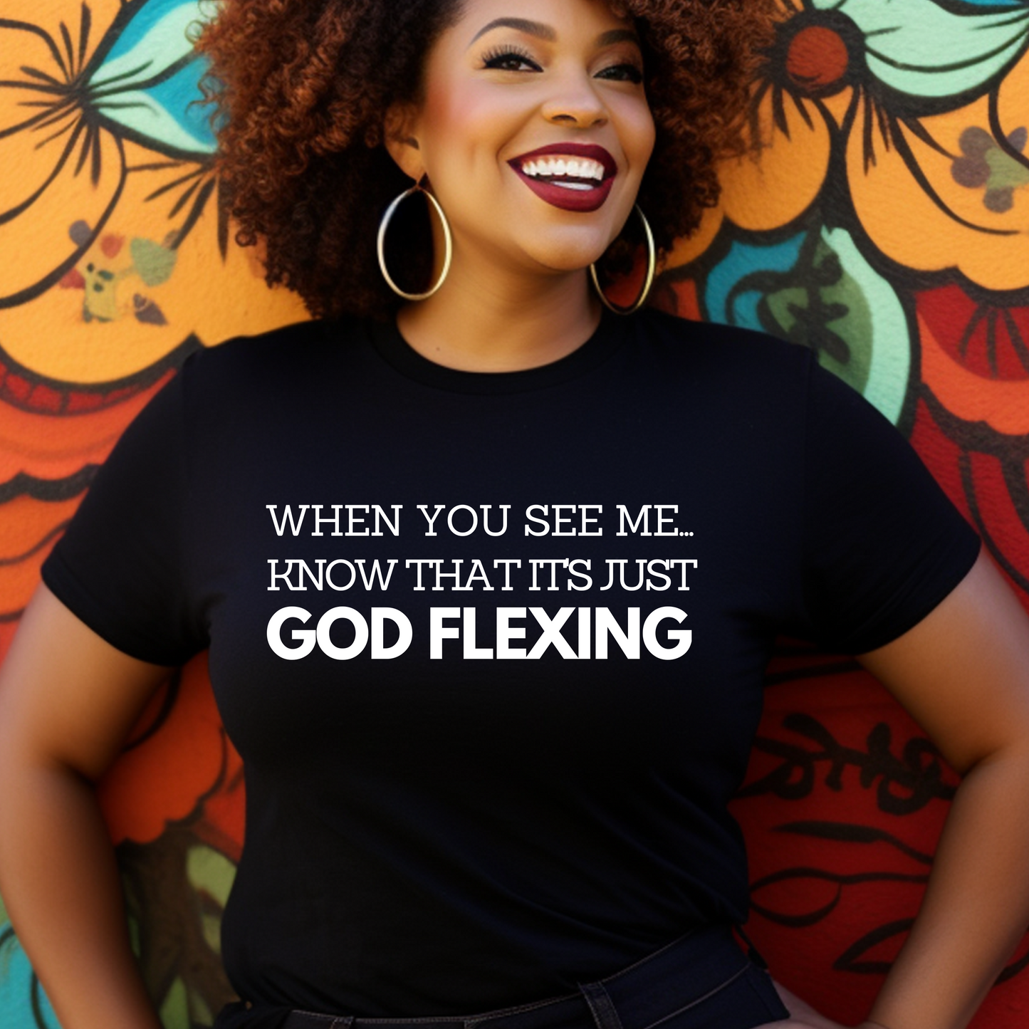 Chic black 'When You See Me Know That it's just God Flexing' T-shirt from Triumph Tees. This faith-based apparel is a trendy way to showcase your belief and express your love for God.