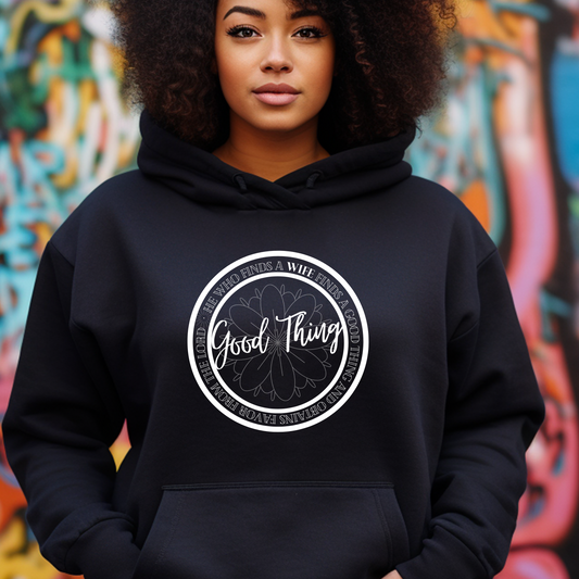 Sleek black 'Good Thing' hoodie from Triumph Tees, based on Proverbs 18:22. This faith-centric apparel is a stylish way to express your belief and recognize God's favor.