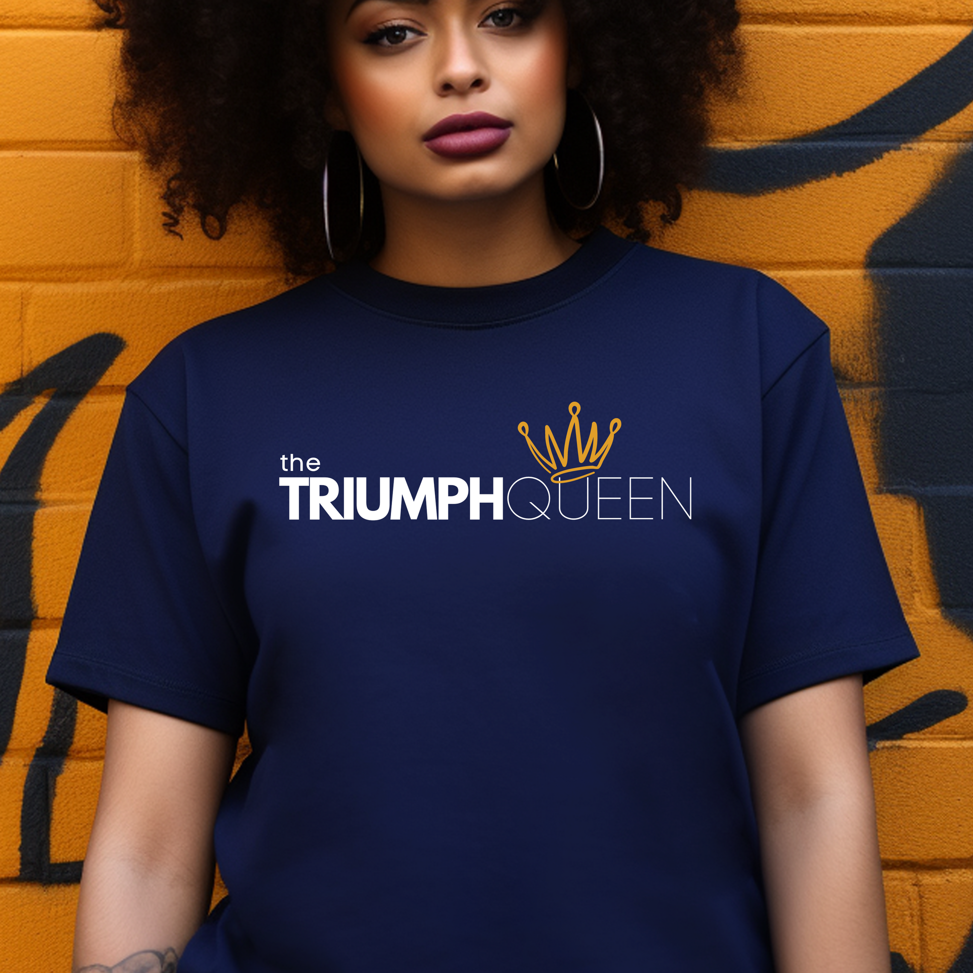 Navy Triumph Queen T-shirt from Triumph Tees, a faith-based clothing brand. This quality Christian t-shirt showcases a bold, white logo in the centre, representing faith and empowerment. Ideal for those seeking trendy faith apparel.