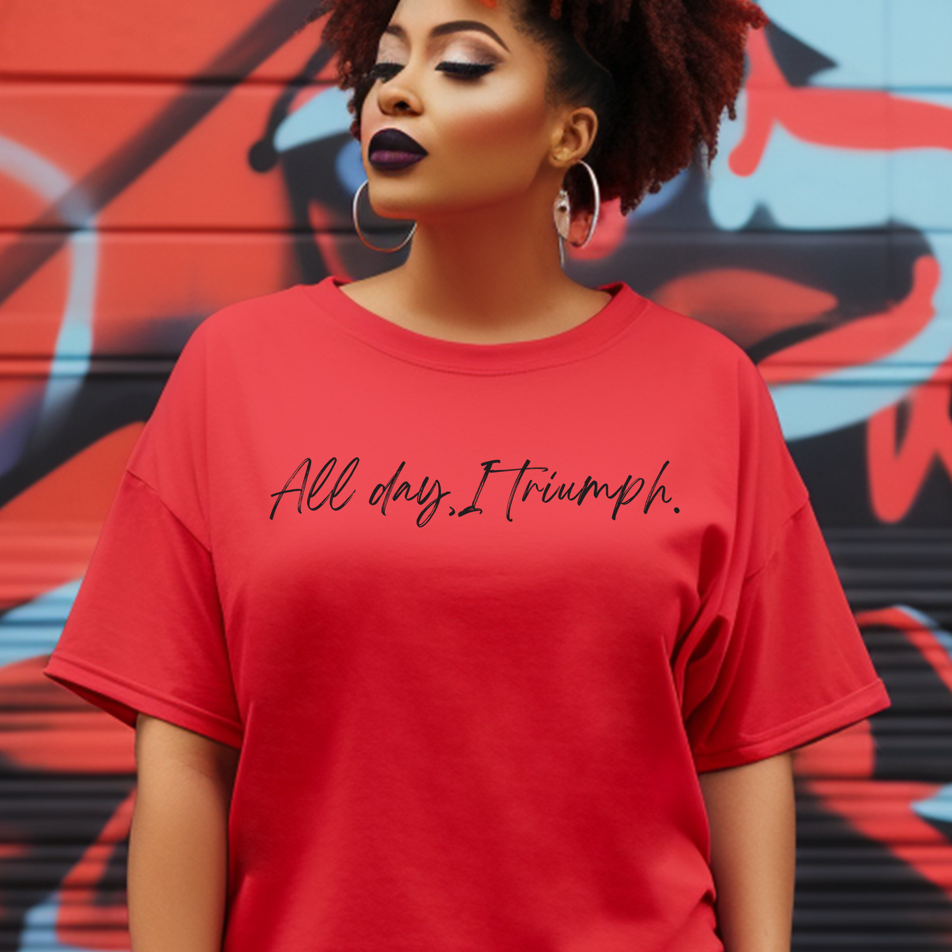 Bold red 'All Day I Triumph' t-shirt from Triumph Tees, designed to inspire faith and courage. Ideal faith apparel for those who believe they are empowered by God to overcome any adversity.