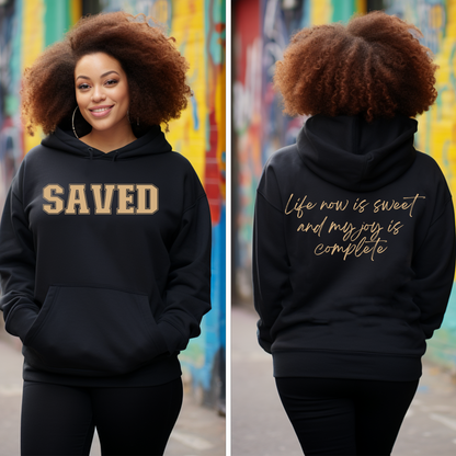 Shop Triumph Tees' black and gold Saved pullover hoodie - a faith-inspired statement piece. Cozy, versatile, and available only at Triumph Tees. Ramp up your style today!