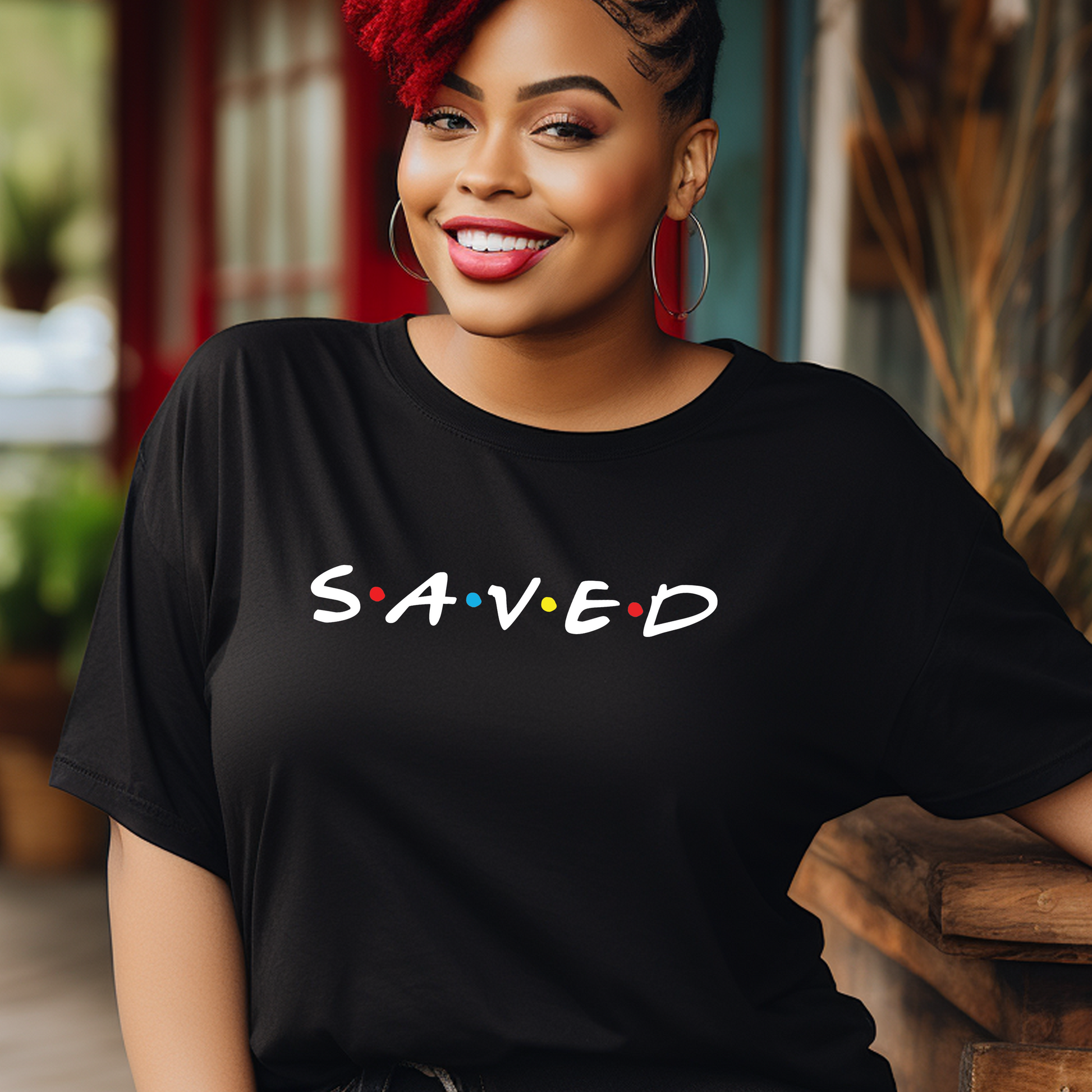 Stylish black 'Saved' t-shirt at Triumph Tees, representing salvation and faith. This God-inspired apparel item is a bold testament of religious conviction.