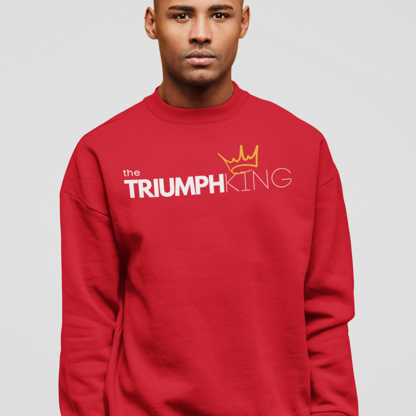 Shop our Triumph King red sweatshirt. This cozy faith based apparel is for Christian men who know they're more than conquerors with Christ. Enjoy this soft and comfy sweatshirt everyday.